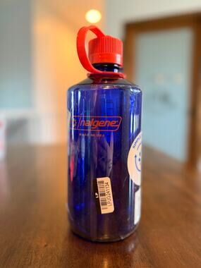 Nalogene Water Bottle Narrow Mouth Lid Orange and Blue